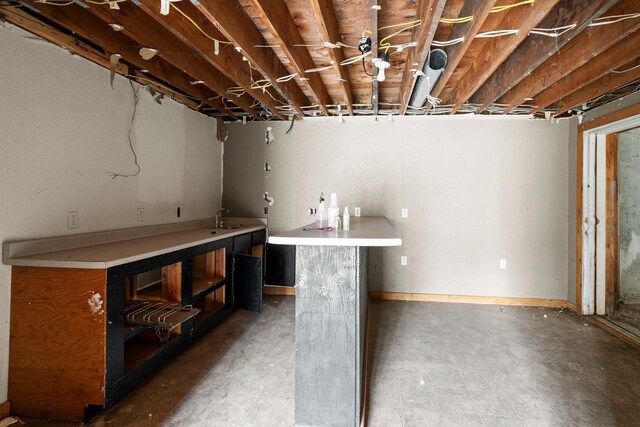unfinished basement featuring a sink