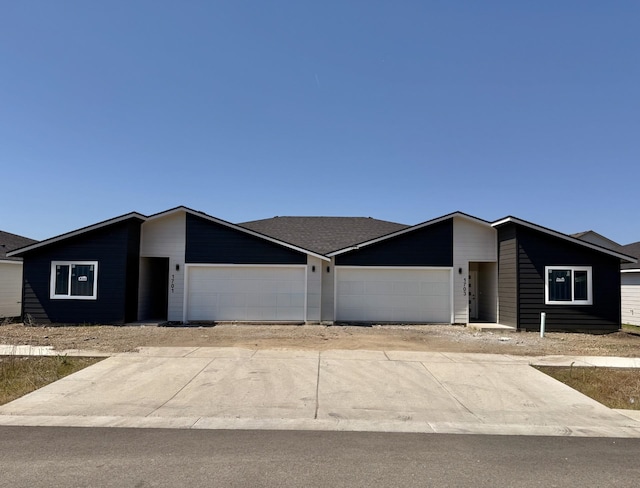 view of front of home with a garage and driveway