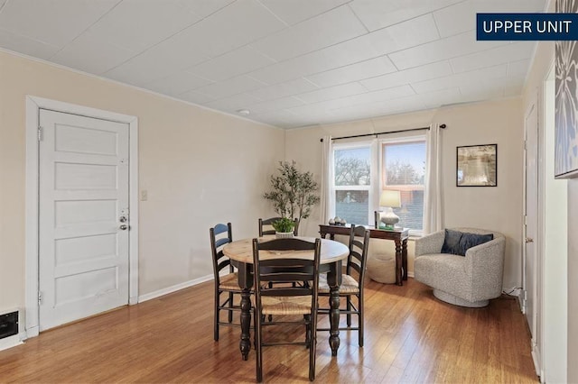 sitting room featuring baseboards, ceiling fan, ornamental molding, and wood finished floors