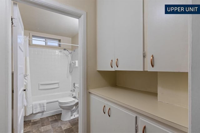 kitchen with a sink, light countertops, white cabinets, and visible vents