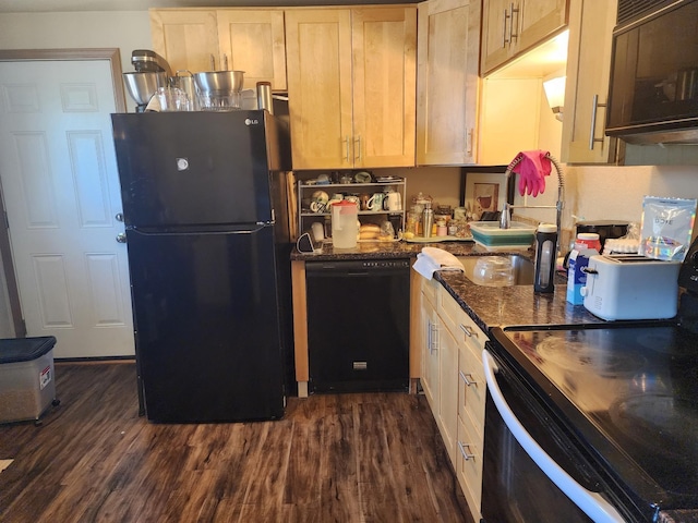 1418 E Dalton Ave, Spokane, WA 99207 - kitchen with black appliances, dark wood-style floors, a sink, and dark stone countertops
