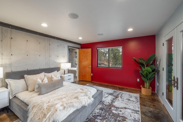 bedroom featuring recessed lighting and finished concrete flooring