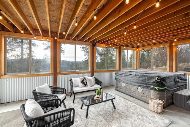 sunroom featuring outdoor lounge area and a jacuzzi