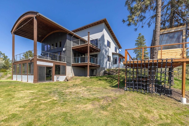 back of property featuring a yard