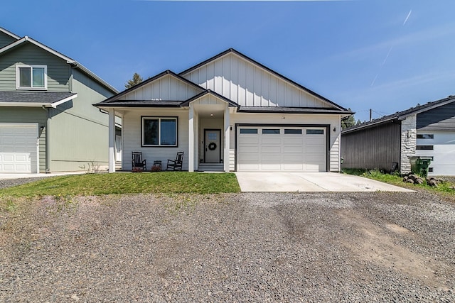 view of front of house featuring a porch, a garage, board and batten siding, and driveway