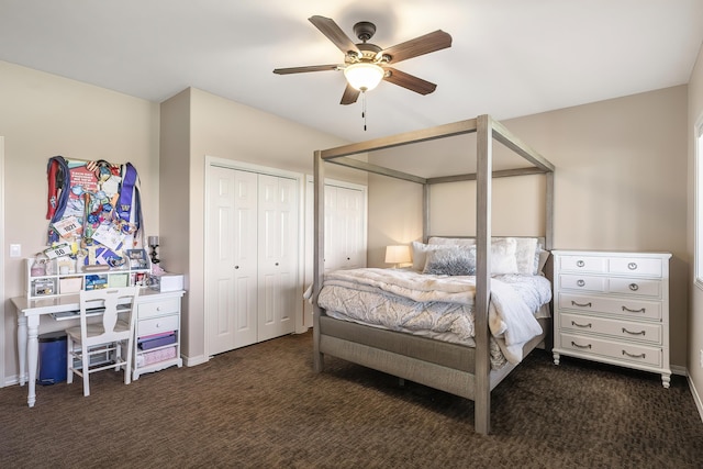 bedroom with a ceiling fan, baseboards, multiple closets, and carpet