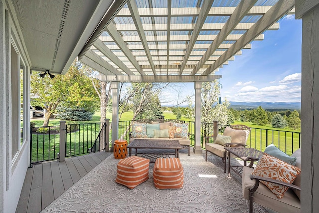 wooden terrace featuring a lawn, a pergola, an outdoor living space, and a mountain view