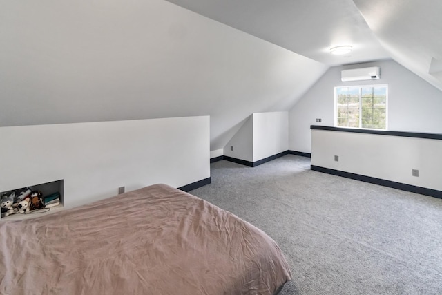 bedroom featuring carpet flooring, an AC wall unit, baseboards, and lofted ceiling