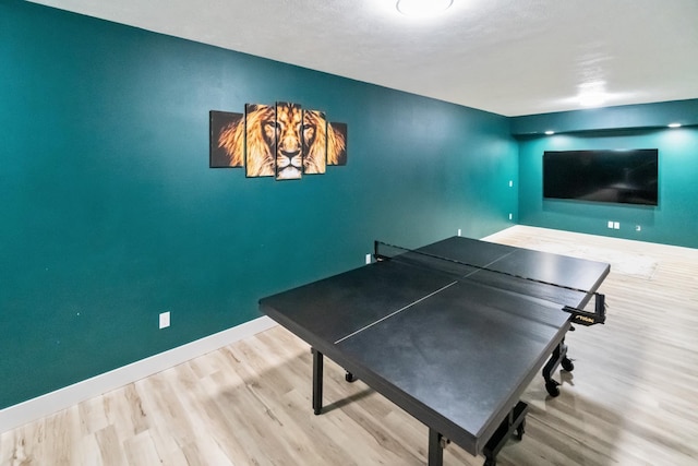 game room featuring baseboards and wood finished floors