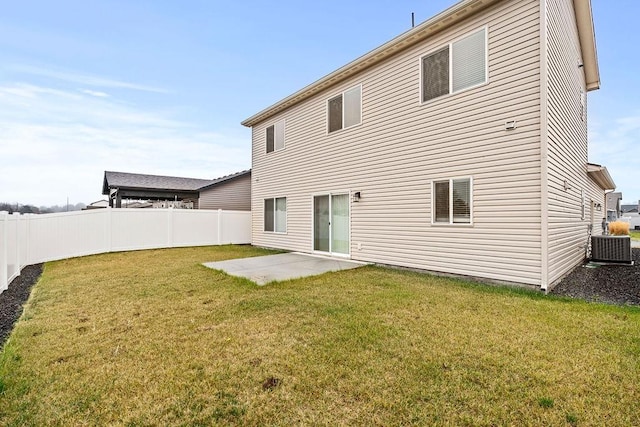 rear view of property with a patio, a fenced backyard, central air condition unit, and a yard