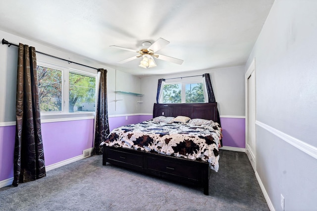 bedroom with carpet floors, baseboards, visible vents, and ceiling fan