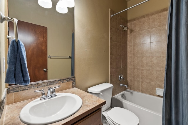 bathroom featuring vanity, a textured wall, shower / bath combo, and toilet