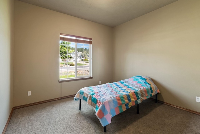 carpeted bedroom with baseboards