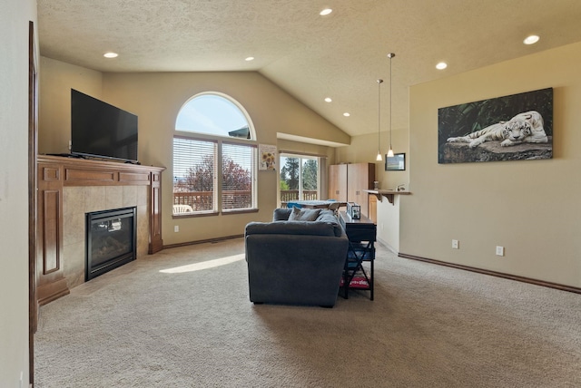 living area with a fireplace, baseboards, light colored carpet, recessed lighting, and a textured ceiling