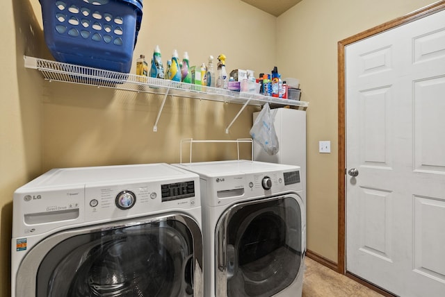 washroom with independent washer and dryer, laundry area, and baseboards