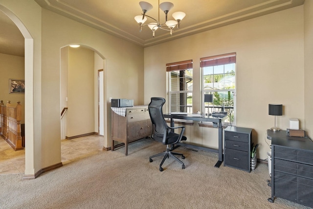 home office featuring an inviting chandelier, arched walkways, baseboards, and light colored carpet