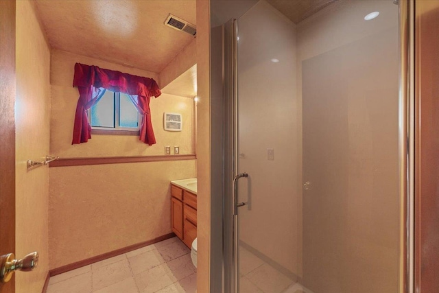 bathroom with visible vents, a shower stall, vanity, tile patterned floors, and toilet