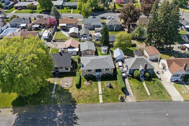 birds eye view of property with a residential view