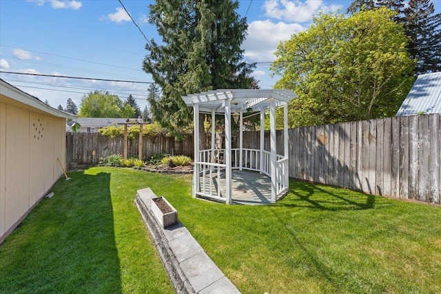 view of yard with a fenced backyard and a pergola