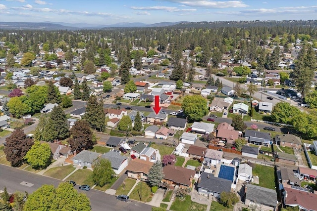 bird's eye view with a residential view, a mountain view, and a forest view