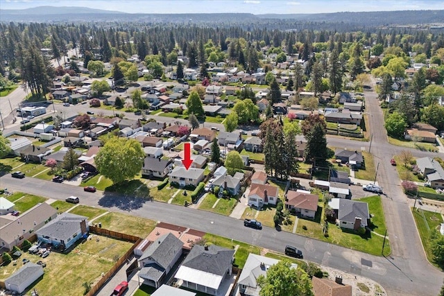 birds eye view of property with a forest view and a residential view