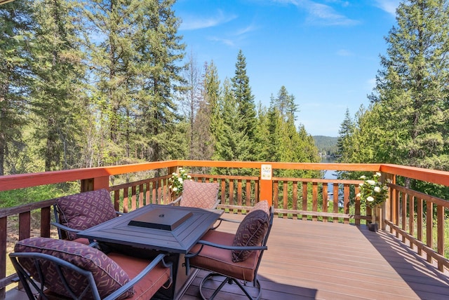 wooden deck featuring outdoor dining area