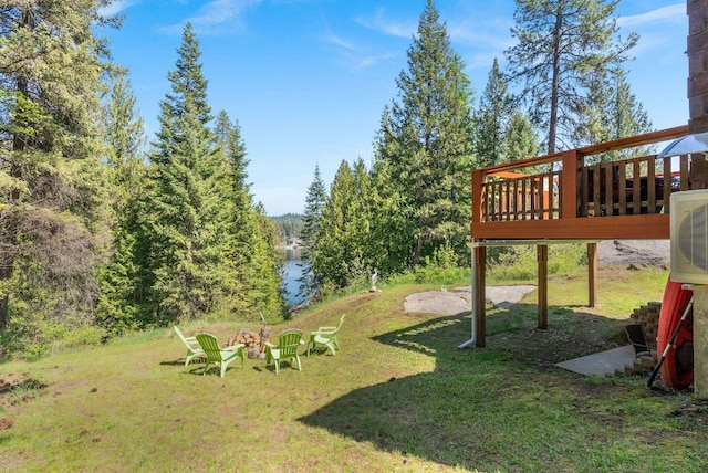 view of yard with a wooden deck and ac unit