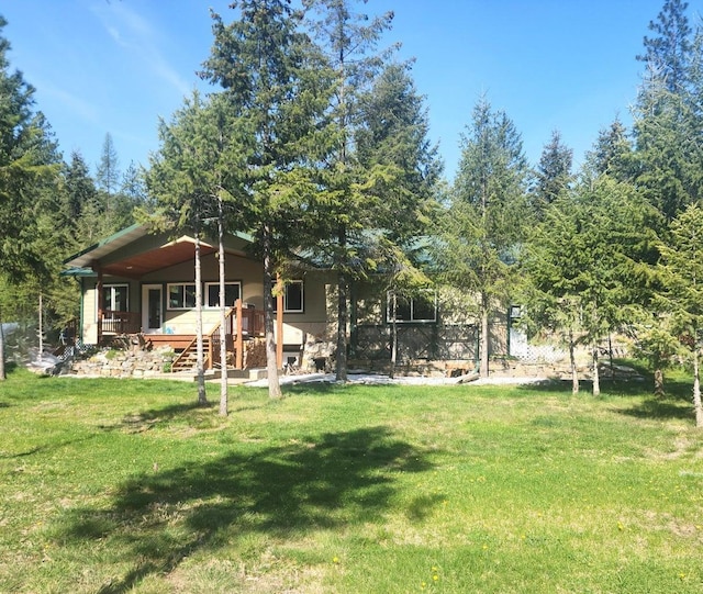 view of yard with covered porch