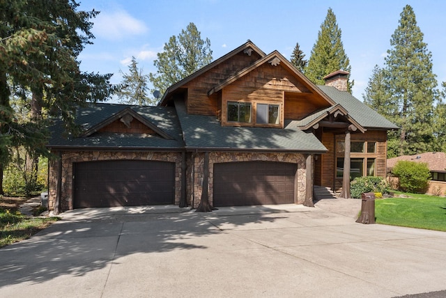 8605 E S Riverway Ave, Spokane, WA 99212 - view of front of property featuring a shingled roof, a front lawn, stone siding, a chimney, and driveway