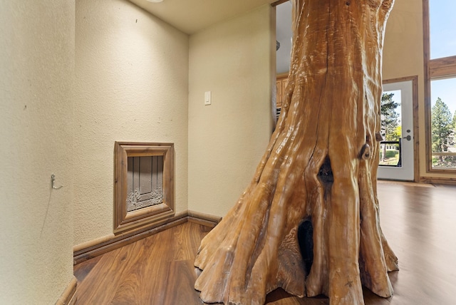 8605 E S Riverway Ave, Spokane, WA 99212 - room details featuring baseboards, a textured wall, and wood finished floors