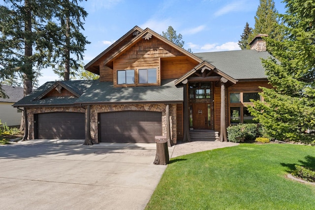 8605 E S Riverway Ave, Spokane, WA 99212 - craftsman house with a front lawn, stone siding, a chimney, a shingled roof, and driveway