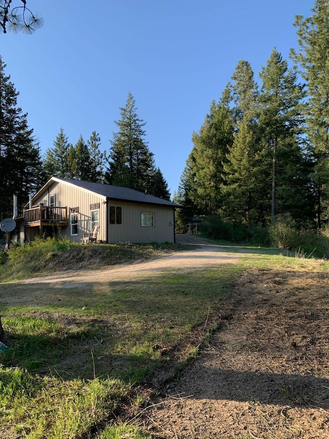 view of yard featuring a wooden deck