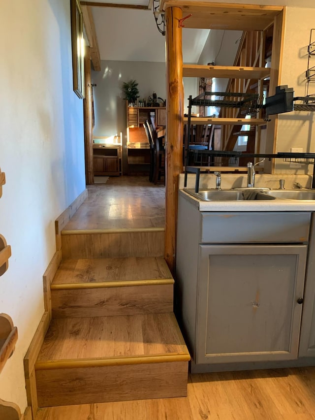 staircase with wood finished floors