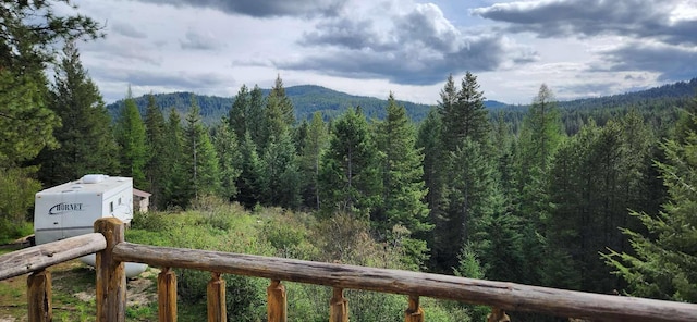 mountain view with a wooded view