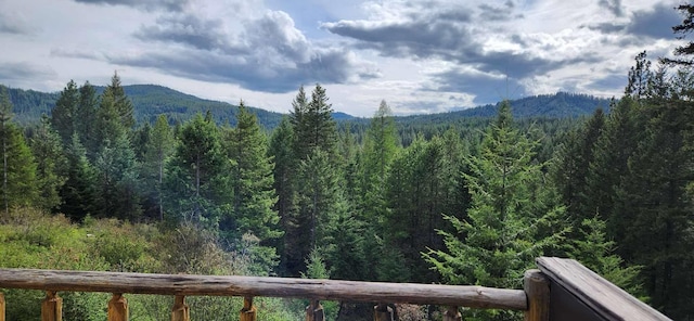mountain view featuring a view of trees