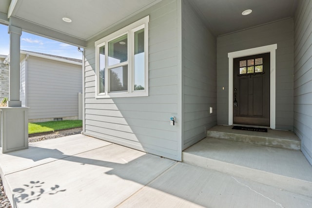 property entrance featuring covered porch