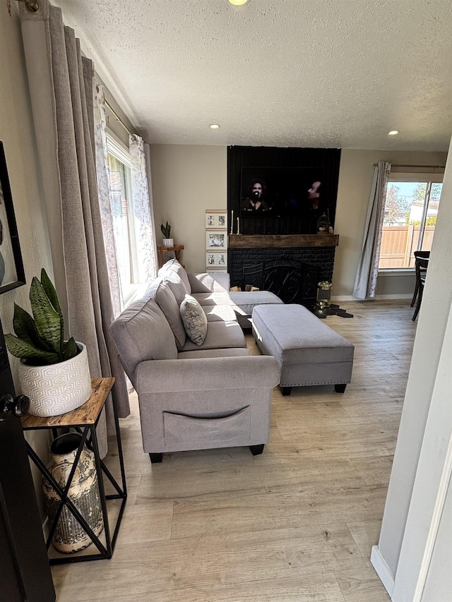 3204 W Queen Pl, Spokane, WA 99205 - living area with light wood-style floors, recessed lighting, and a textured ceiling