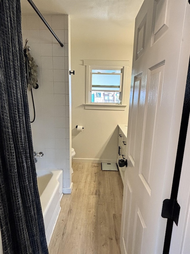 3204 W Queen Pl, Spokane, WA 99205 - full bath with baseboards, toilet, vanity, wood finished floors, and shower / bath combo