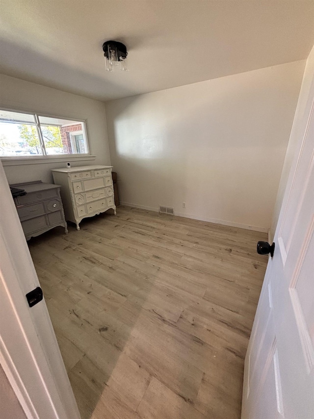 3204 W Queen Pl, Spokane, WA 99205 - unfurnished bedroom featuring light wood finished floors, baseboards, and visible vents
