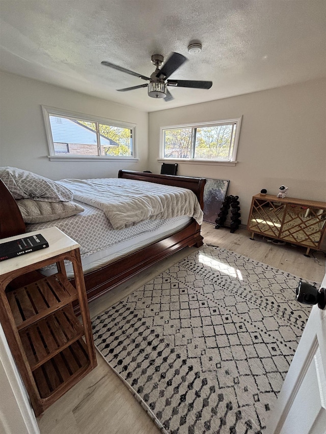 3204 W Queen Pl, Spokane, WA 99205 - bedroom featuring a textured ceiling, wood finished floors, and ceiling fan