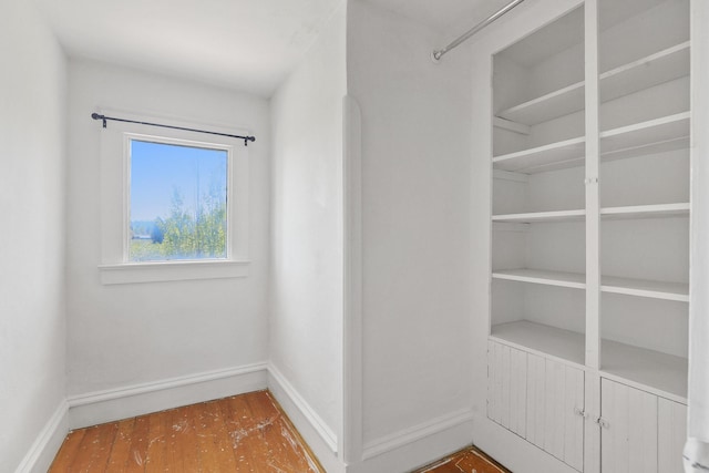 spacious closet with wood finished floors