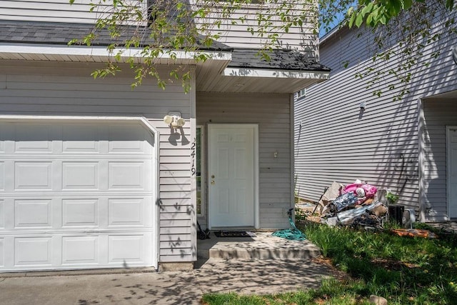 doorway to property featuring an attached garage