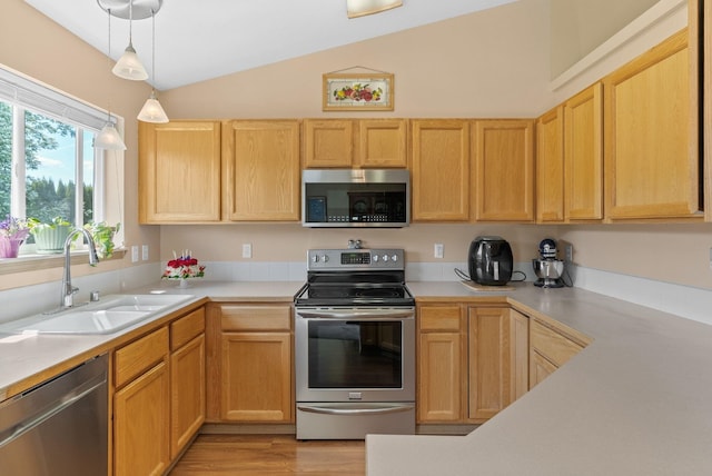 19322 E Indiana Ave, Greenacres, WA 99016 - kitchen featuring light countertops, appliances with stainless steel finishes, lofted ceiling, and a sink