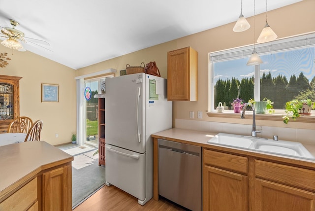 19322 E Indiana Ave, Greenacres, WA 99016 - kitchen with freestanding refrigerator, lofted ceiling, a ceiling fan, stainless steel dishwasher, and a sink