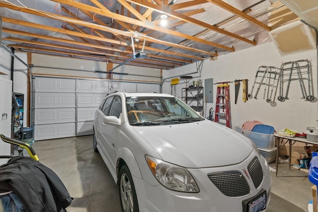 19322 E Indiana Ave, Greenacres, WA 99016 - garage featuring electric panel and a garage door opener