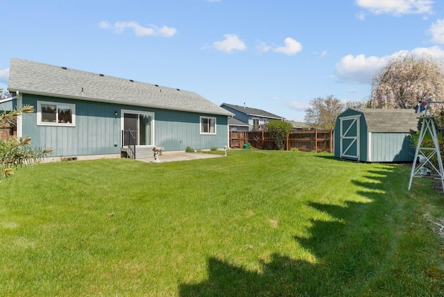 19322 E Indiana Ave, Greenacres, WA 99016 - rear view of house with a storage shed, a patio area, an outdoor structure, a fenced backyard, and entry steps