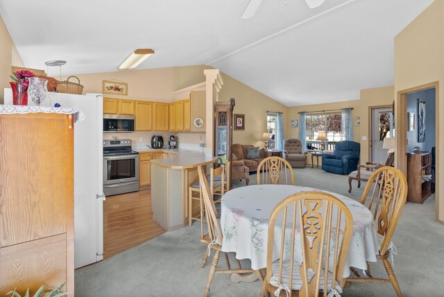 19322 E Indiana Ave, Greenacres, WA 99016 - dining area featuring light colored carpet, lofted ceiling, and ceiling fan