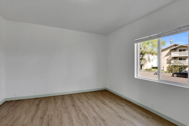 1801 W Sharp Ave, Spokane, WA 99201 - spare room with wood finished floors and baseboards