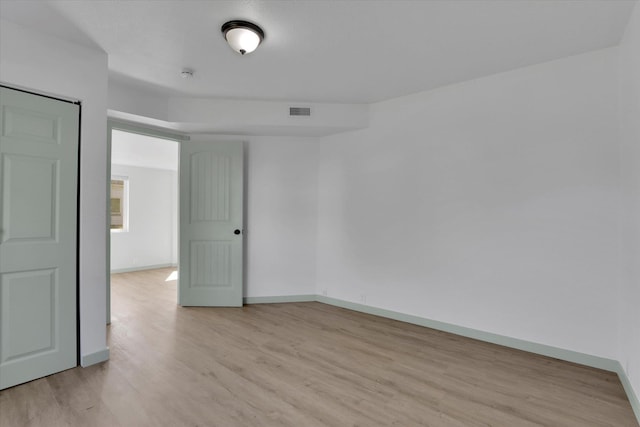 1801 W Sharp Ave, Spokane, WA 99201 - spare room with light wood-style flooring and a smoke detector