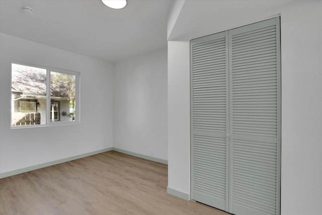 1801 W Sharp Ave, Spokane, WA 99201 - unfurnished bedroom with a closet and light wood finished floors
